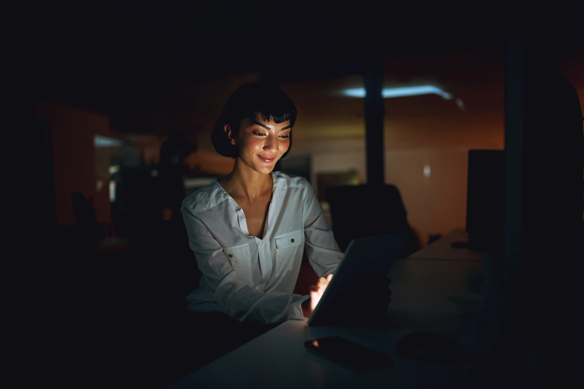 Office night woman with tablet typing technology with project deadline schedule business evening creative agency with employee consultant graphic design internet with app copy