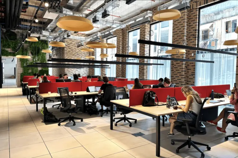 Coworking space in Poblenou, Barcelona with shared desks, natural light and an international community of remote professionals and entrepreneurs at La Fábrica & Co.